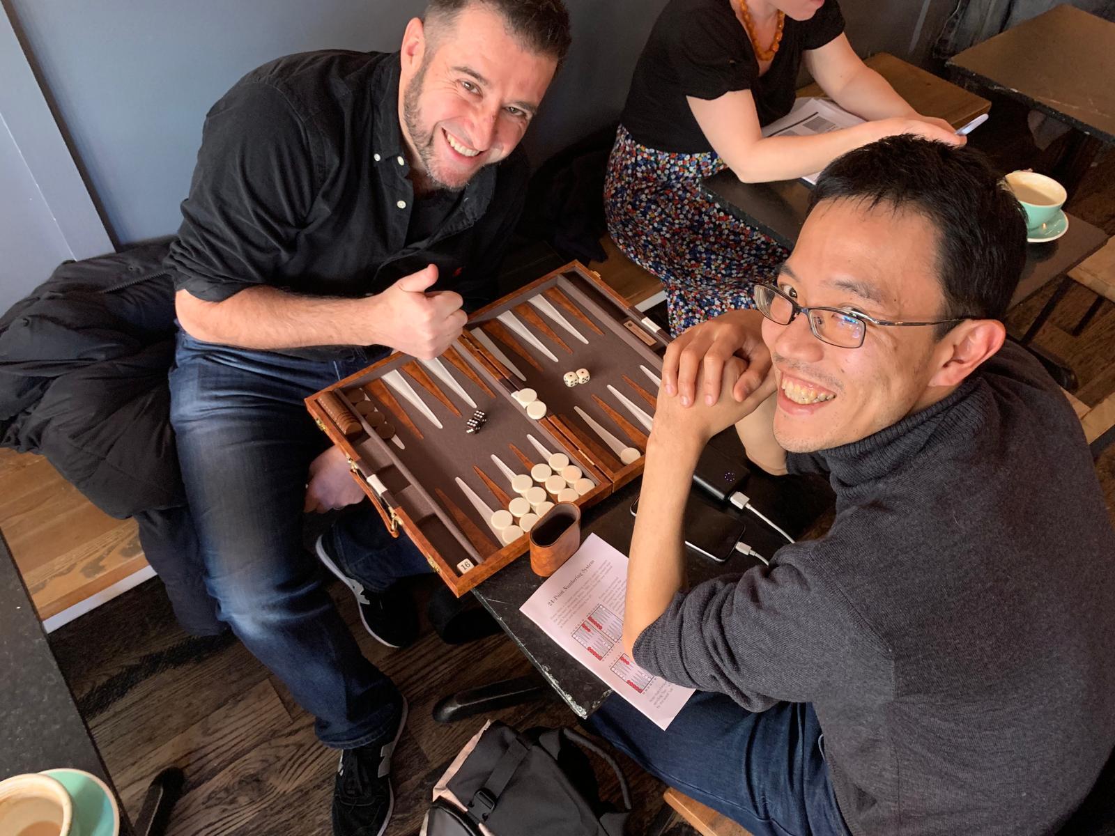 Friends playing backgammon together